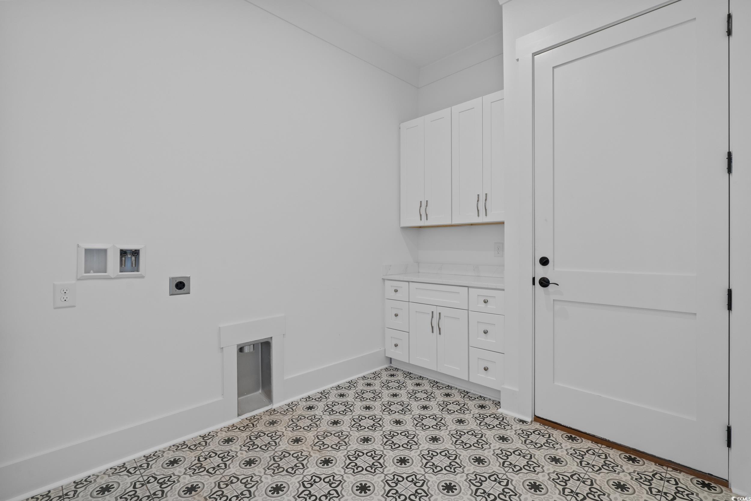 921 Crystal Water Way Myrtle Beach, SC 29579 - Photo 16 of 36 1st Floor Laundry area featuring hookup for a washing machine, hookup for an electric dryer, and cabinet space