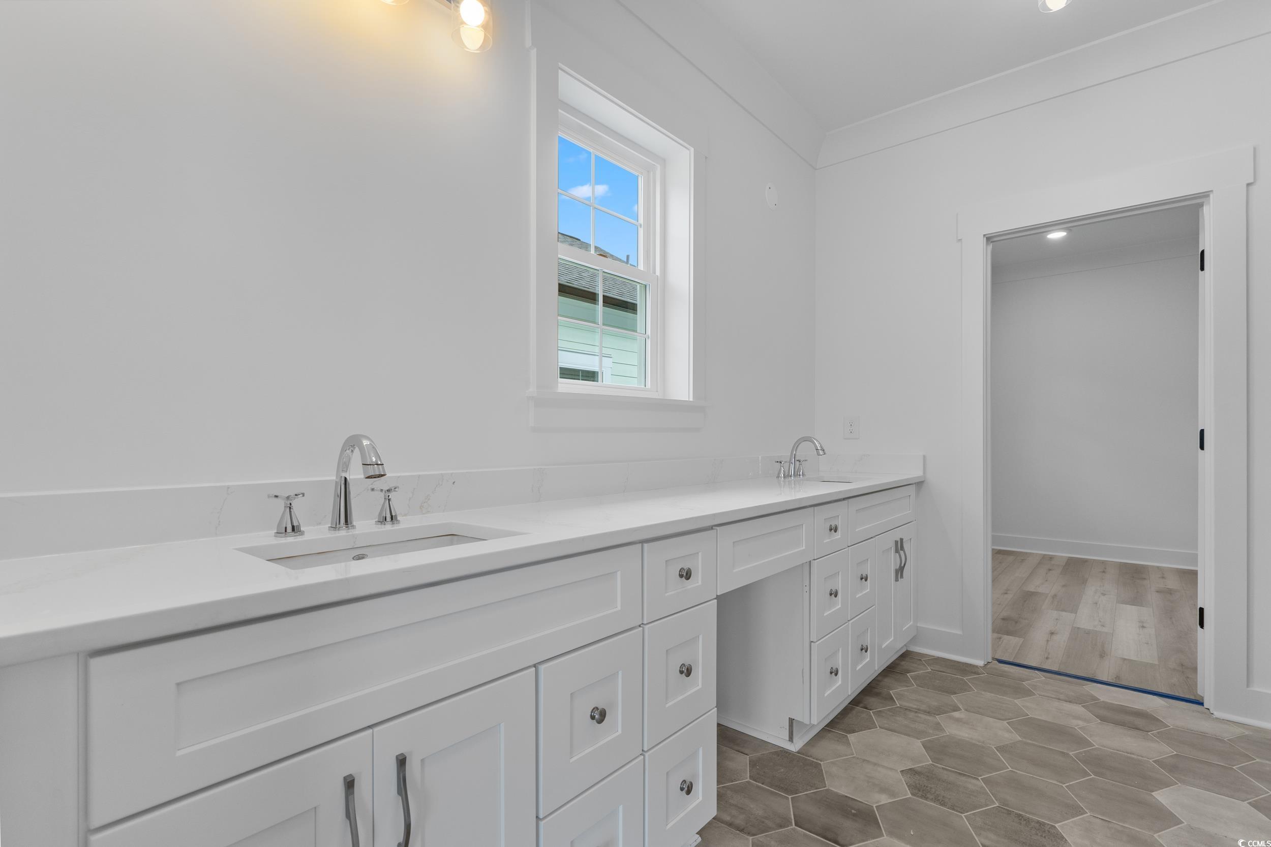 921 Crystal Water Way Myrtle Beach, SC 29579 - Photo 20 of 36 Full bathroom with double vanity and baseboards