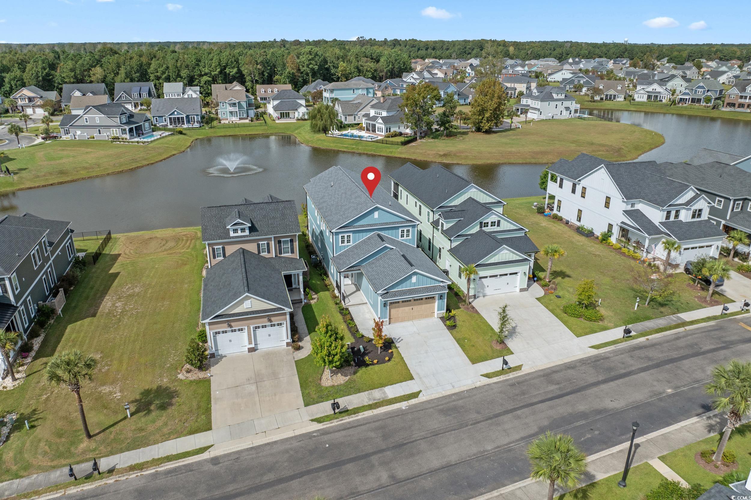 921 Crystal Water Way Myrtle Beach, SC 29579 - Photo 2 of 36 Aerial perspective of suburban area featuring a nearby body of water