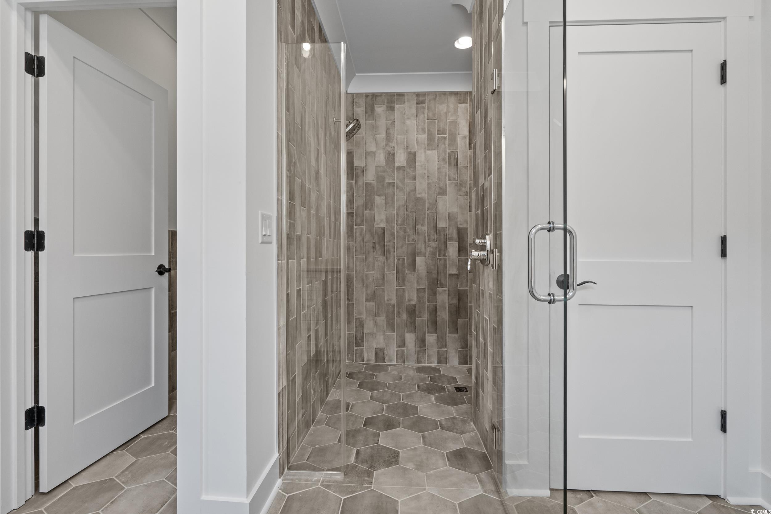 921 Crystal Water Way Myrtle Beach, SC 29579 - Photo 21 of 36 Bathroom featuring a stall shower and light tile patterned floors
