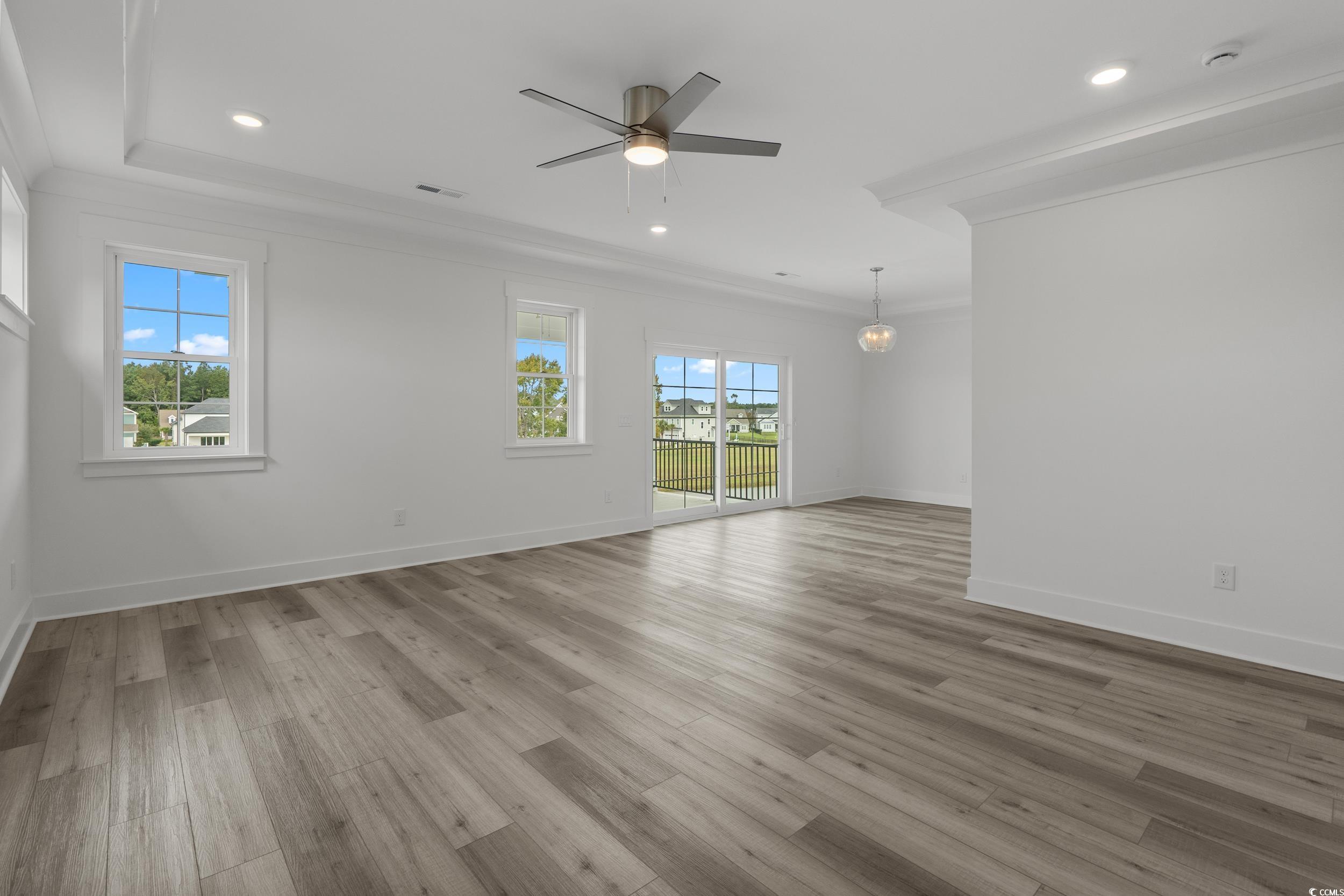 921 Crystal Water Way Myrtle Beach, SC 29579 - Photo 25 of 36 Spare room featuring light wood-style floors, ornamental molding, recessed lighting, and ceiling fan