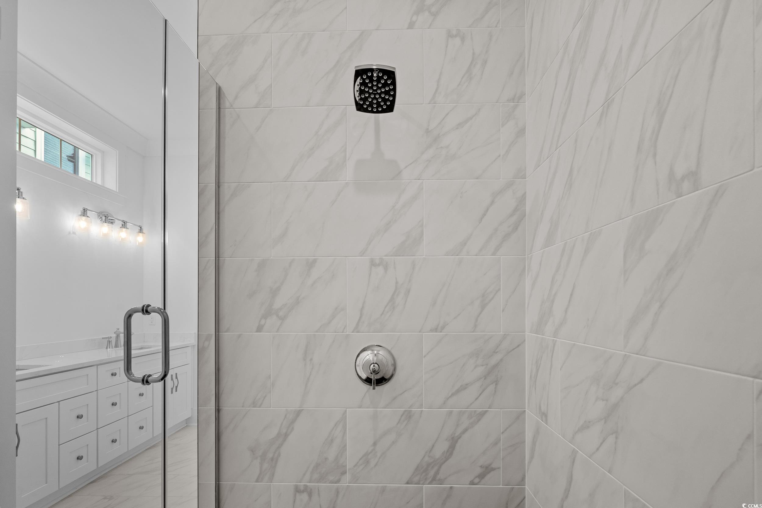 921 Crystal Water Way Myrtle Beach, SC 29579 - Photo 26 of 36 Bathroom featuring a stall shower and vanity