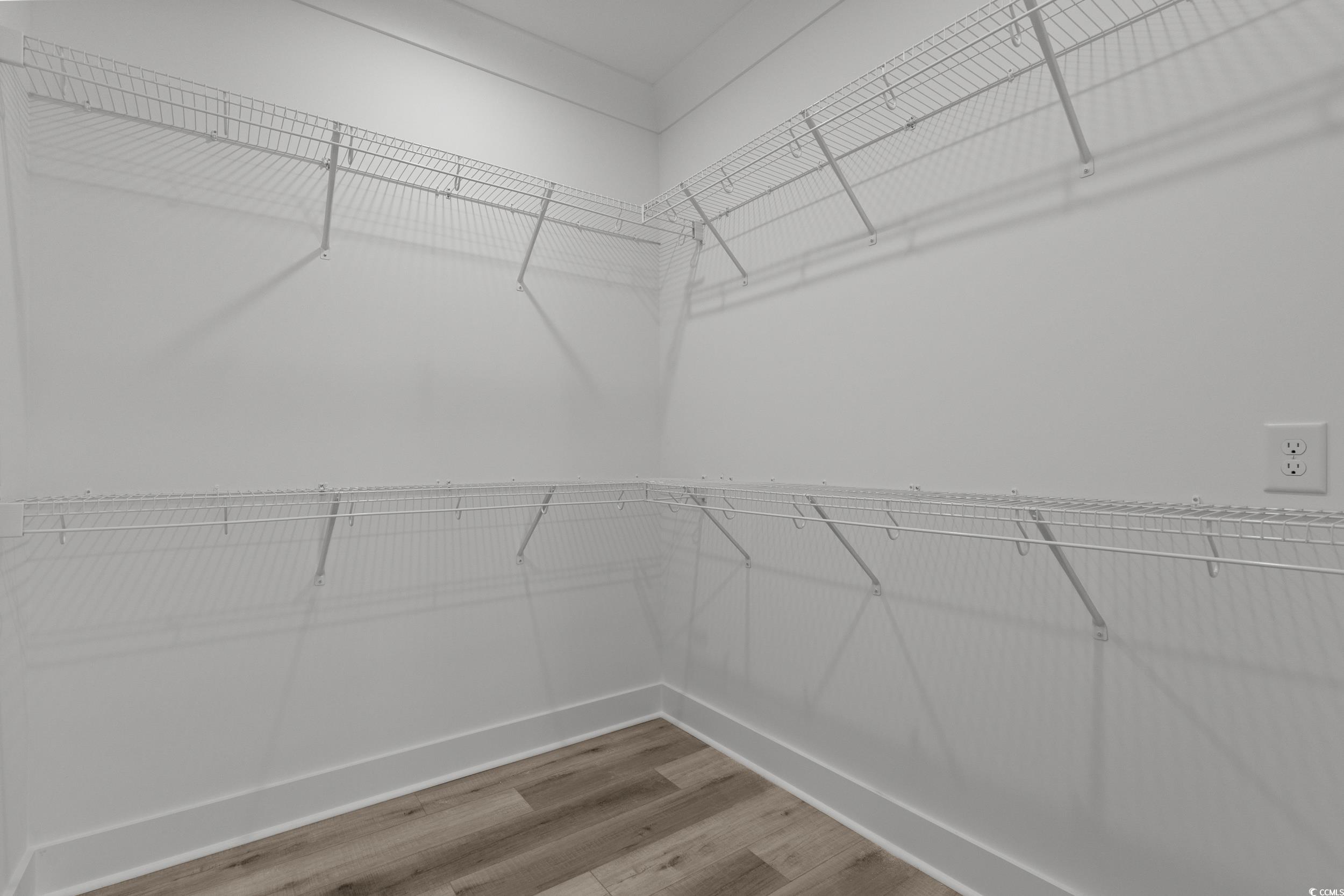 921 Crystal Water Way Myrtle Beach, SC 29579 - Photo 28 of 36 Walk in closet with light wood finished floors