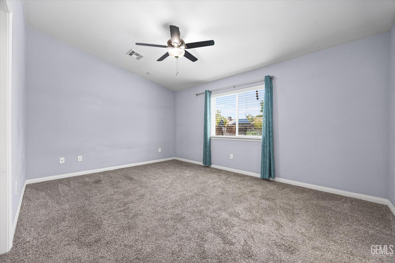 Undisclosed Address Bakersfield, CA 93307 - Photo 15 of 30 a view of an empty room with a window