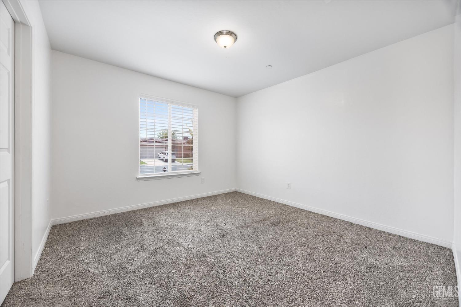 Undisclosed Address Bakersfield, CA 93307 - Photo 23 of 30 an empty room with windows