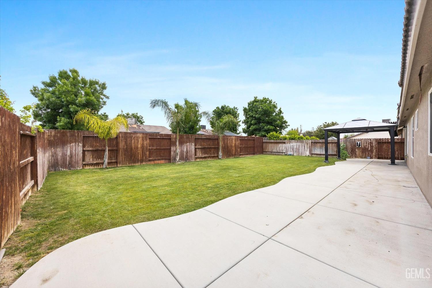 Undisclosed Address Bakersfield, CA 93307 - Photo 28 of 30 a view of a backyard with sitting area