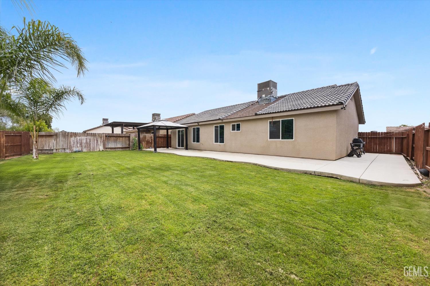 Undisclosed Address Bakersfield, CA 93307 - Photo 29 of 30 a front view of a house with garden