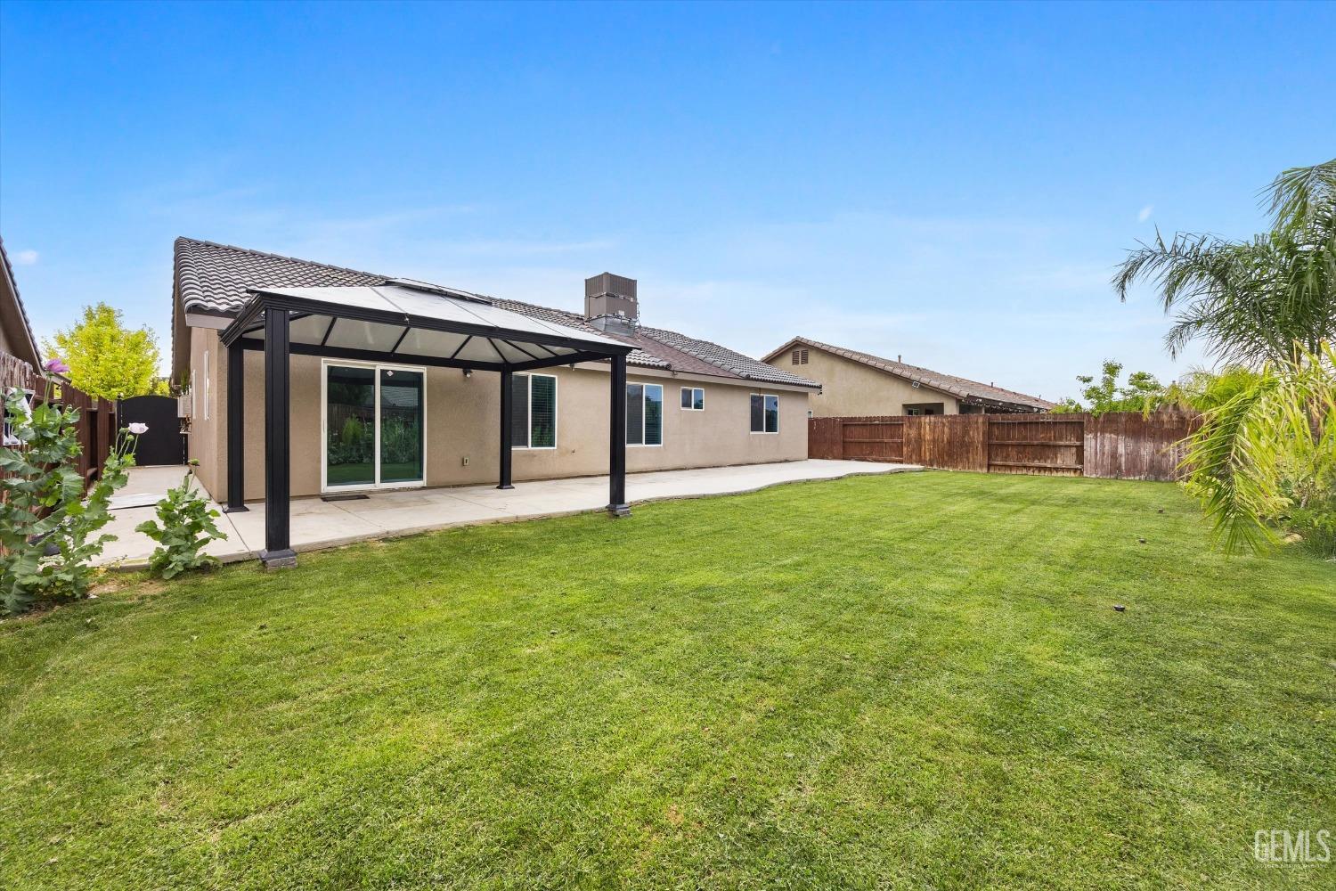 Undisclosed Address Bakersfield, CA 93307 - Photo 30 of 30 a view of house with yard and porch