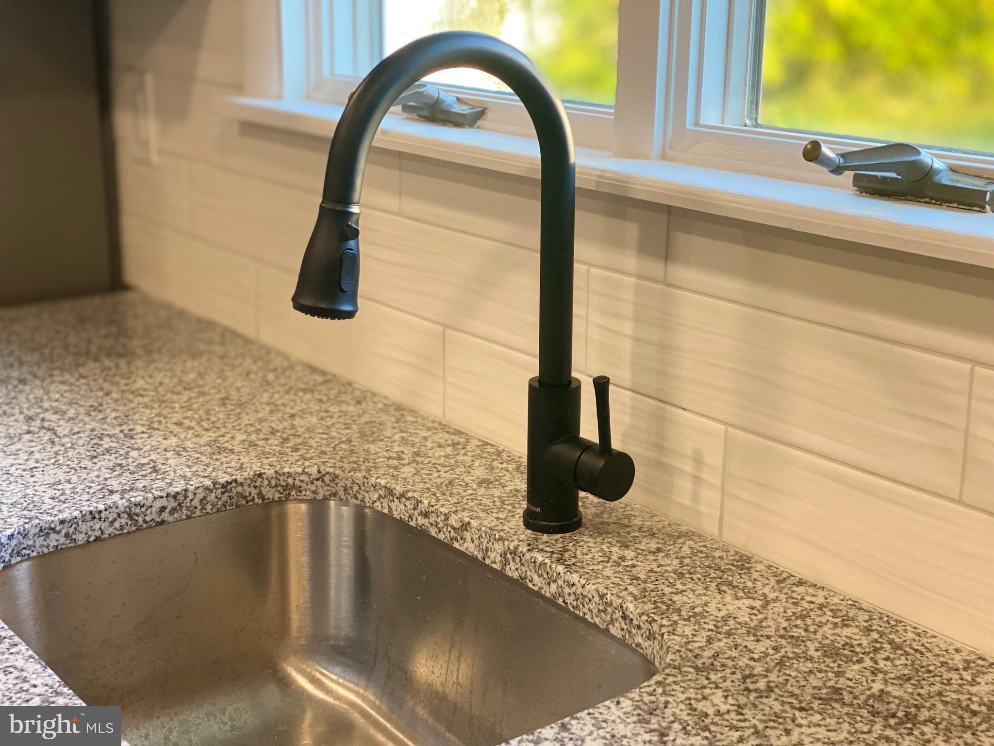 77 Saratoga Road Stratford, NJ 08084 - Photo 10 of 27 Matte Black Fixture and Backsplash