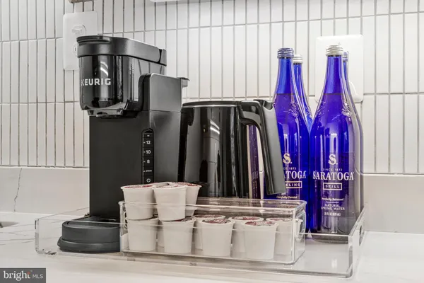 a stove top oven sitting inside of a kitchen