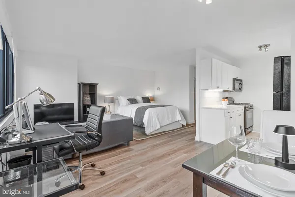 a workspace with furniture and wooden floor