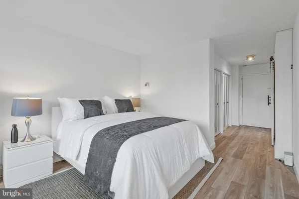 a spacious bedroom with a bed and a table