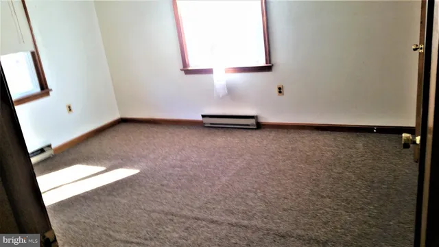 a kitchen with a refrigerator and a stove