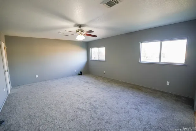 a bathroom with a double vanity sink toilet and a mirror