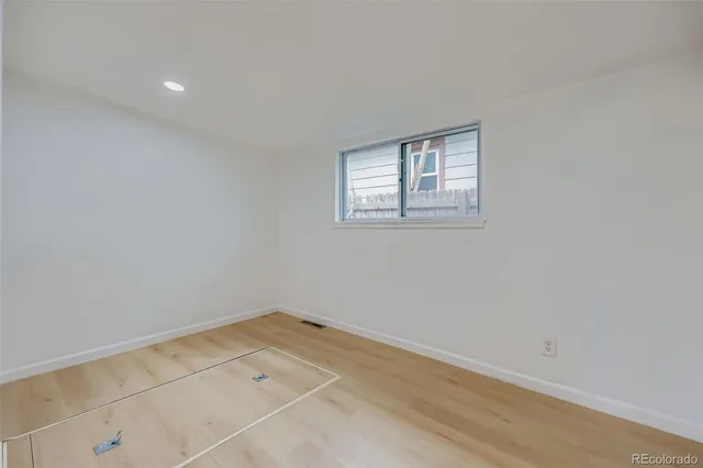 an empty room with a empty space and window