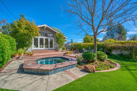 a garden with a table and a chairs