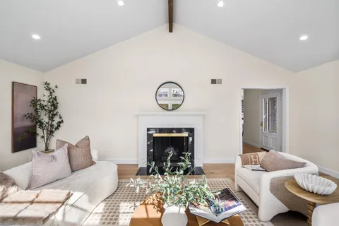 a view of an entryway with wooden floor and a potted plant