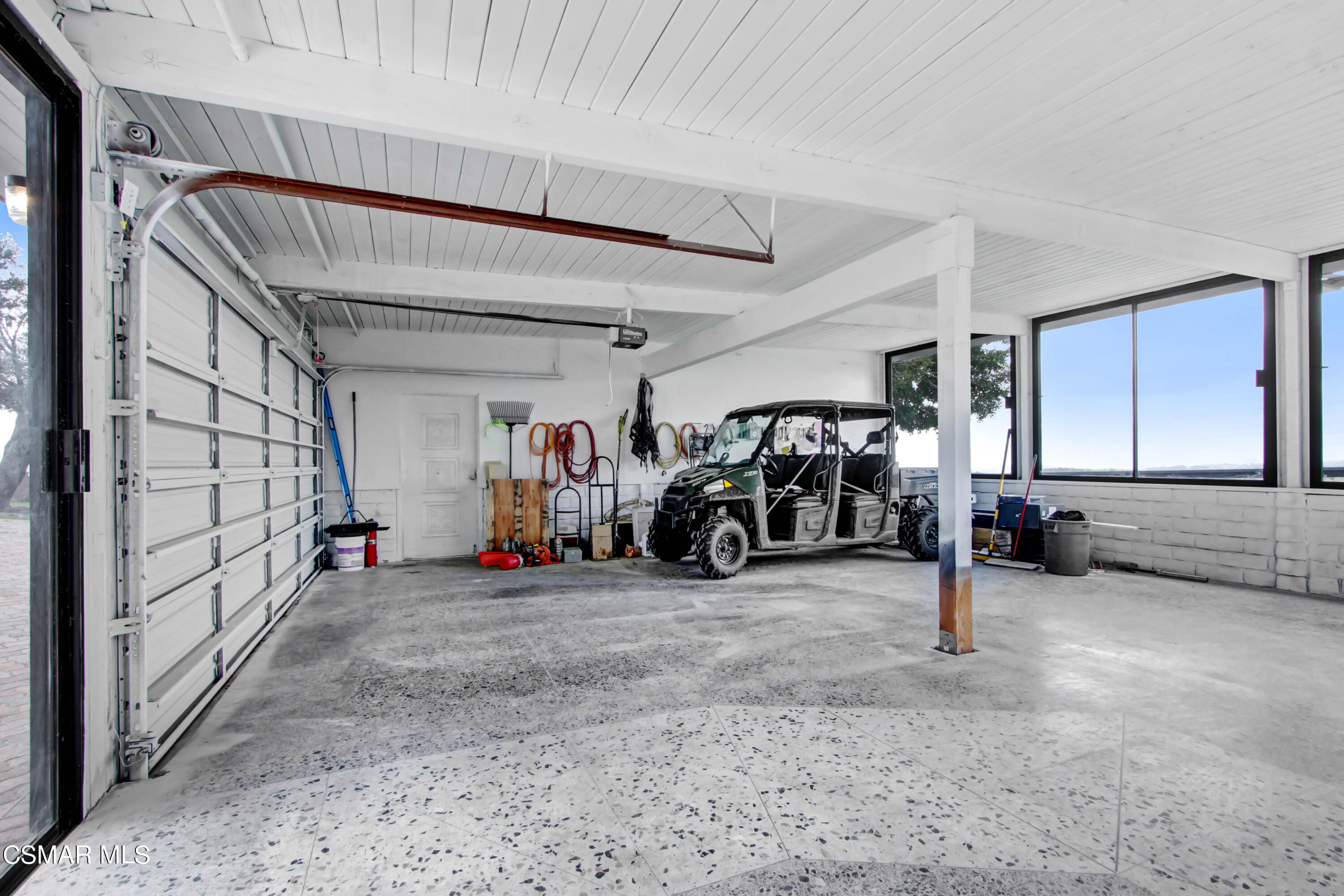 8787 Happy Camp Road Moorpark, CA 93021 - Photo 14 of 33 a view of a garage with a bike and car