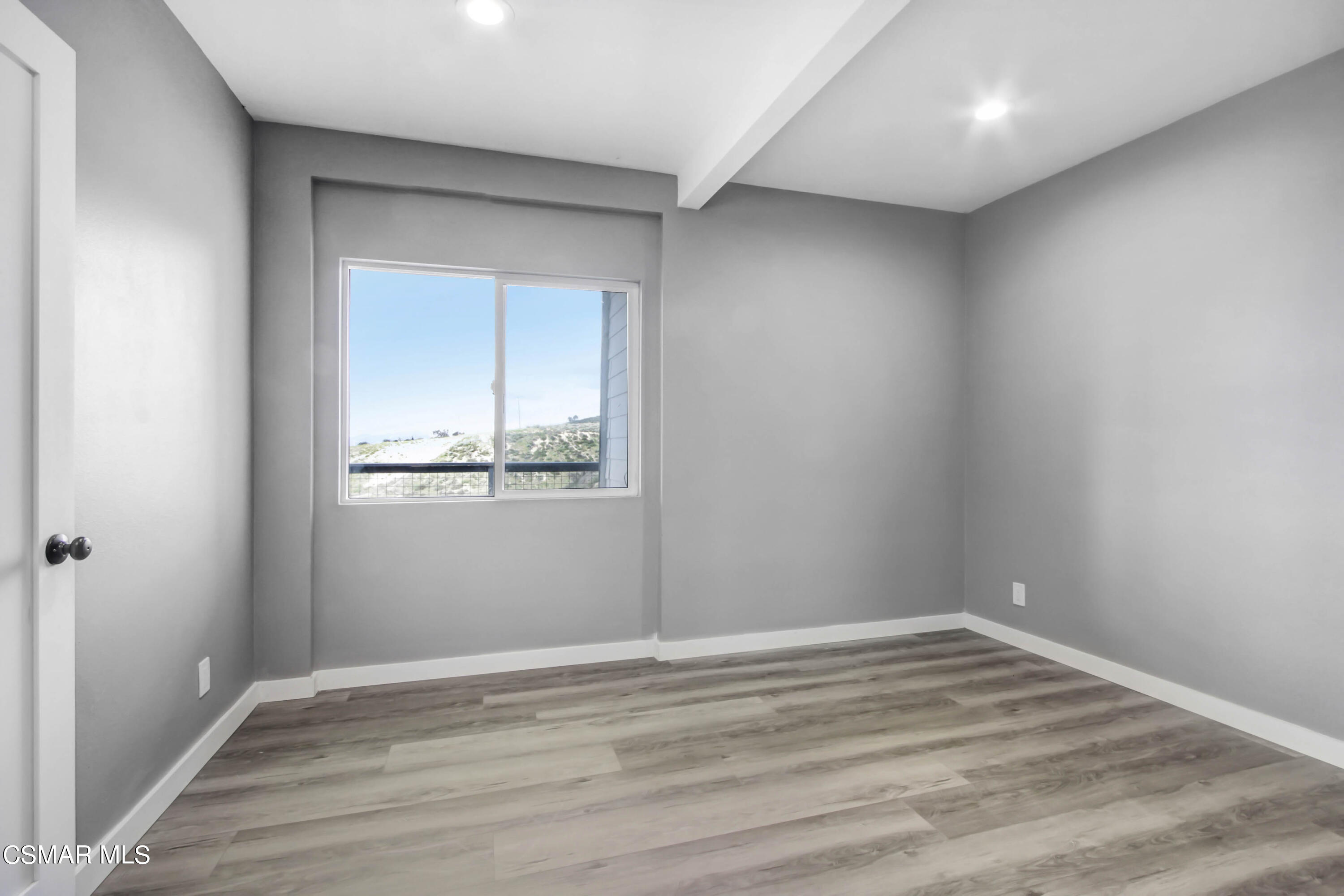 8787 Happy Camp Road Moorpark, CA 93021 - Photo 23 of 33 a view of empty room with wooden floor