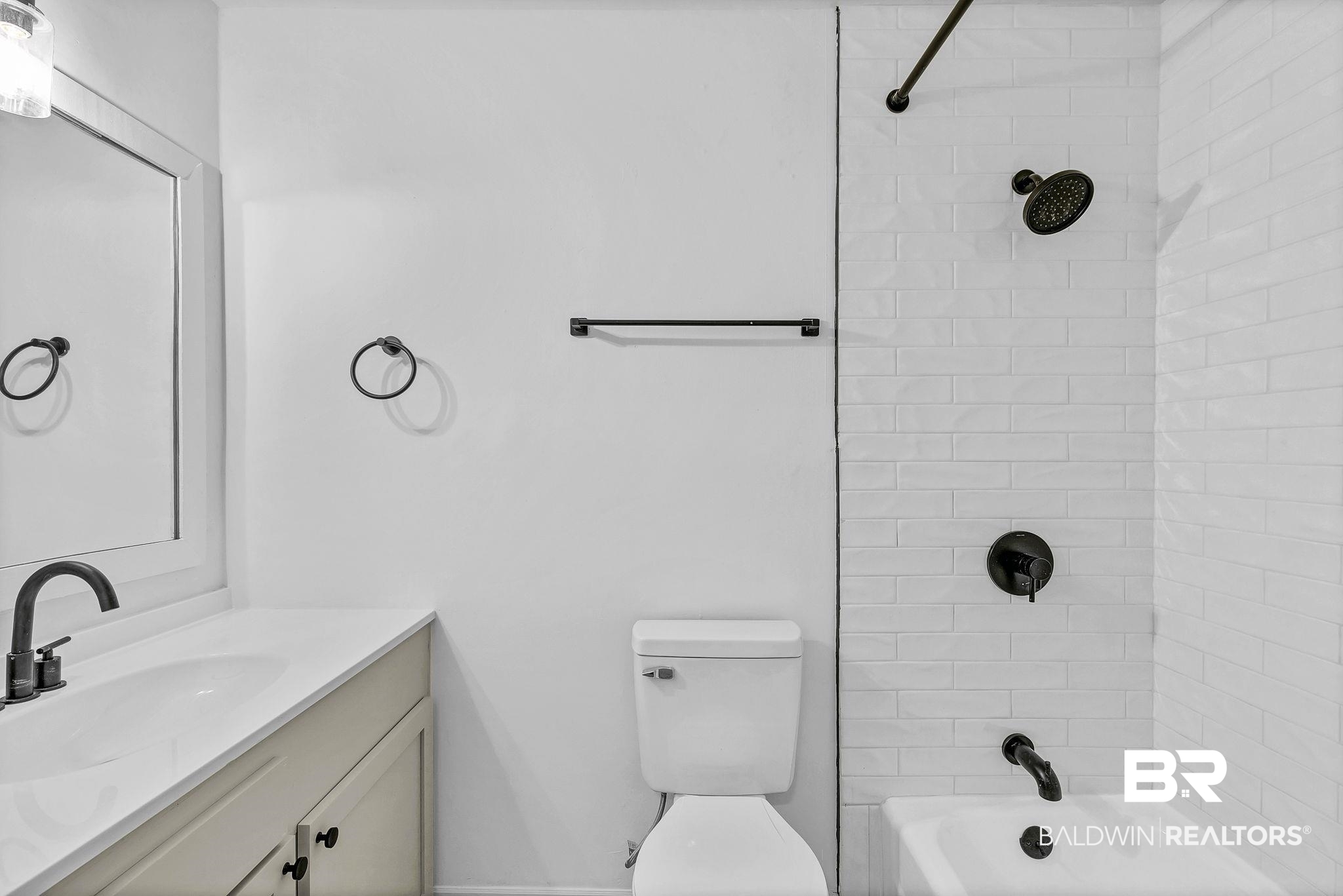 203 Anderson Road Saraland, AL 36571 - Photo 31 of 48 Bathroom with washtub / shower combination, toilet, and vanity
