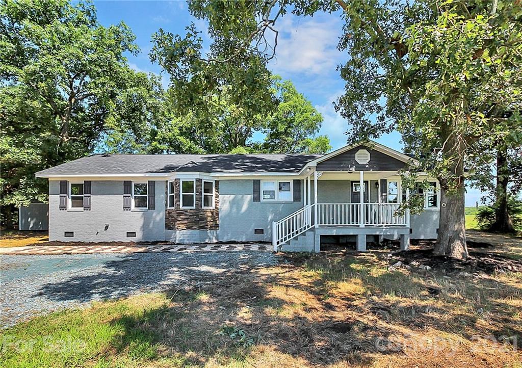 3405 Love Mill Road Monroe, NC 28110 - Photo 1 of 44 a front view of a house with a yard