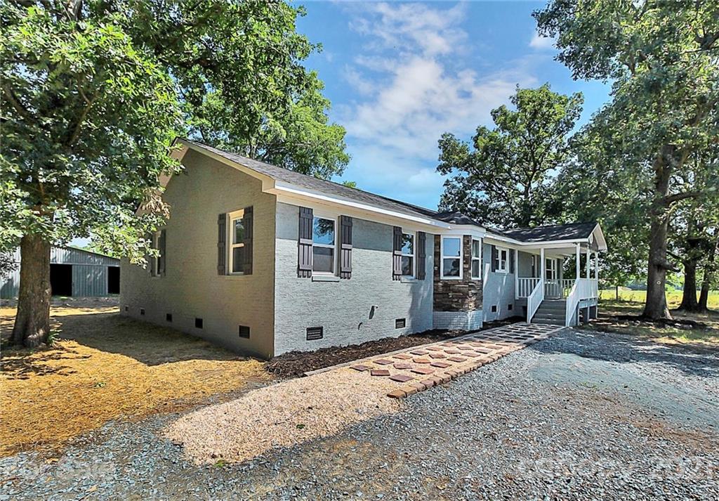 3405 Love Mill Road Monroe, NC 28110 - Photo 2 of 44 a view of a house with a yard