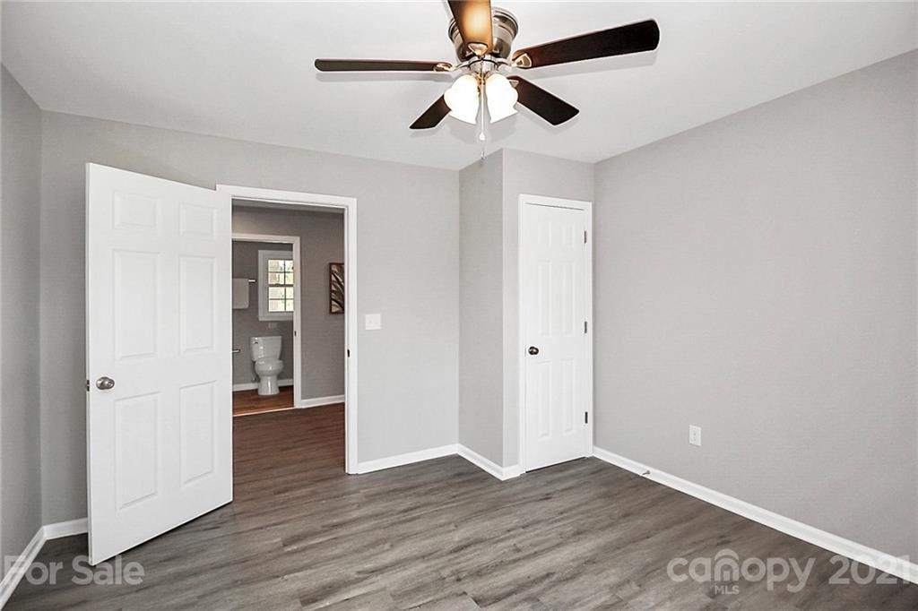 3405 Love Mill Road Monroe, NC 28110 - Photo 25 of 44 wooden floor in an empty room with a window