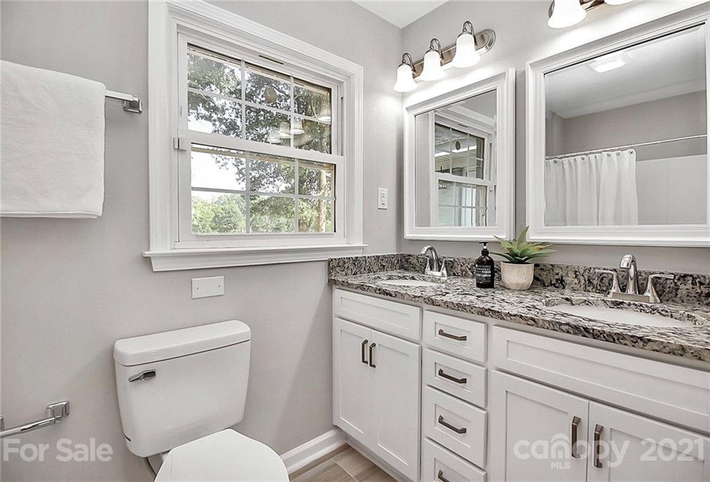 3405 Love Mill Road Monroe, NC 28110 - Photo 26 of 44 a bathroom with a toilet a sink and a window