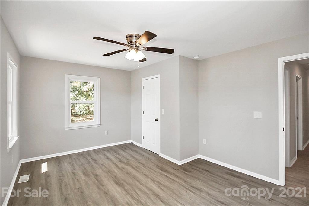 3405 Love Mill Road Monroe, NC 28110 - Photo 28 of 44 a view of an empty room with wooden floor and window