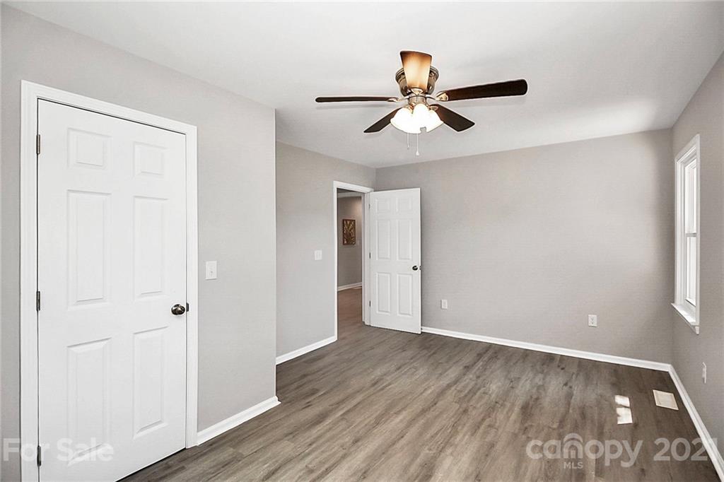 3405 Love Mill Road Monroe, NC 28110 - Photo 31 of 44 a view of empty room with wooden floor and fan