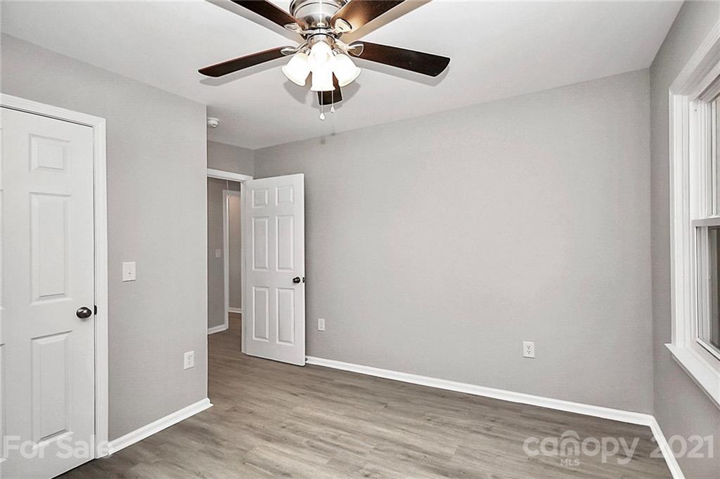 3405 Love Mill Road Monroe, NC 28110 - Photo 32 of 44 wooden floor in an empty room with a window