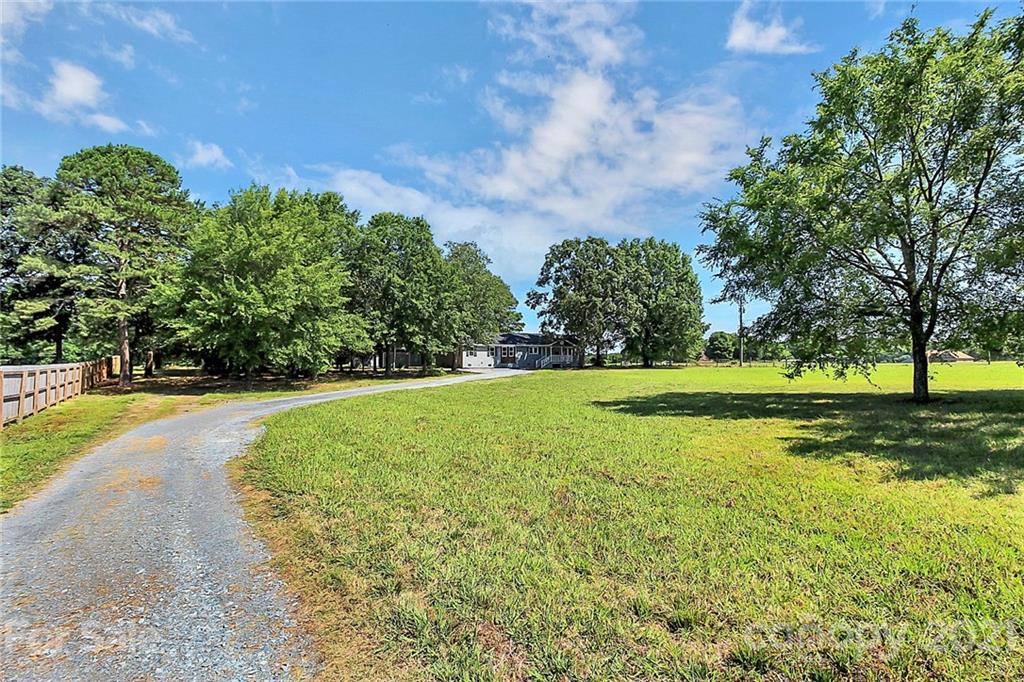 3405 Love Mill Road Monroe, NC 28110 - Photo 42 of 44 a view of a swimming pool and trees in the background