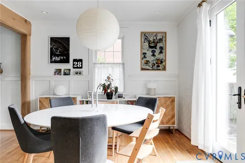 a view of a dining room with furniture and window