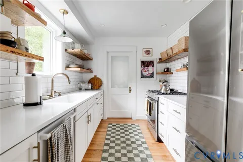 a kitchen with a sink and cabinets