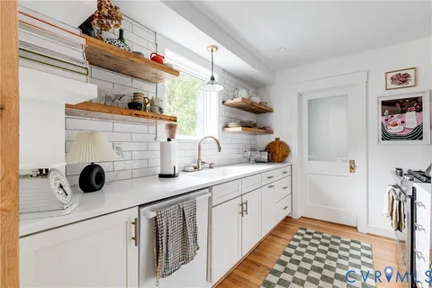 a kitchen with a stove and cabinets
