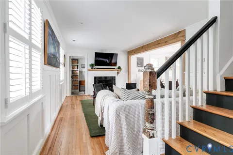 a bedroom with furniture and a large window