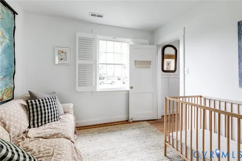 a bedroom with bed and a window