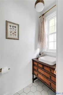 a bathroom with a bathtub and window
