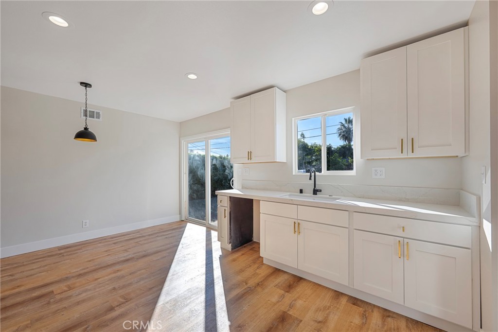 8214 Klusman Avenue Rancho Cucamonga, CA 91730 - Photo 20 of 39 a bathroom with a double vanity sink and mirror