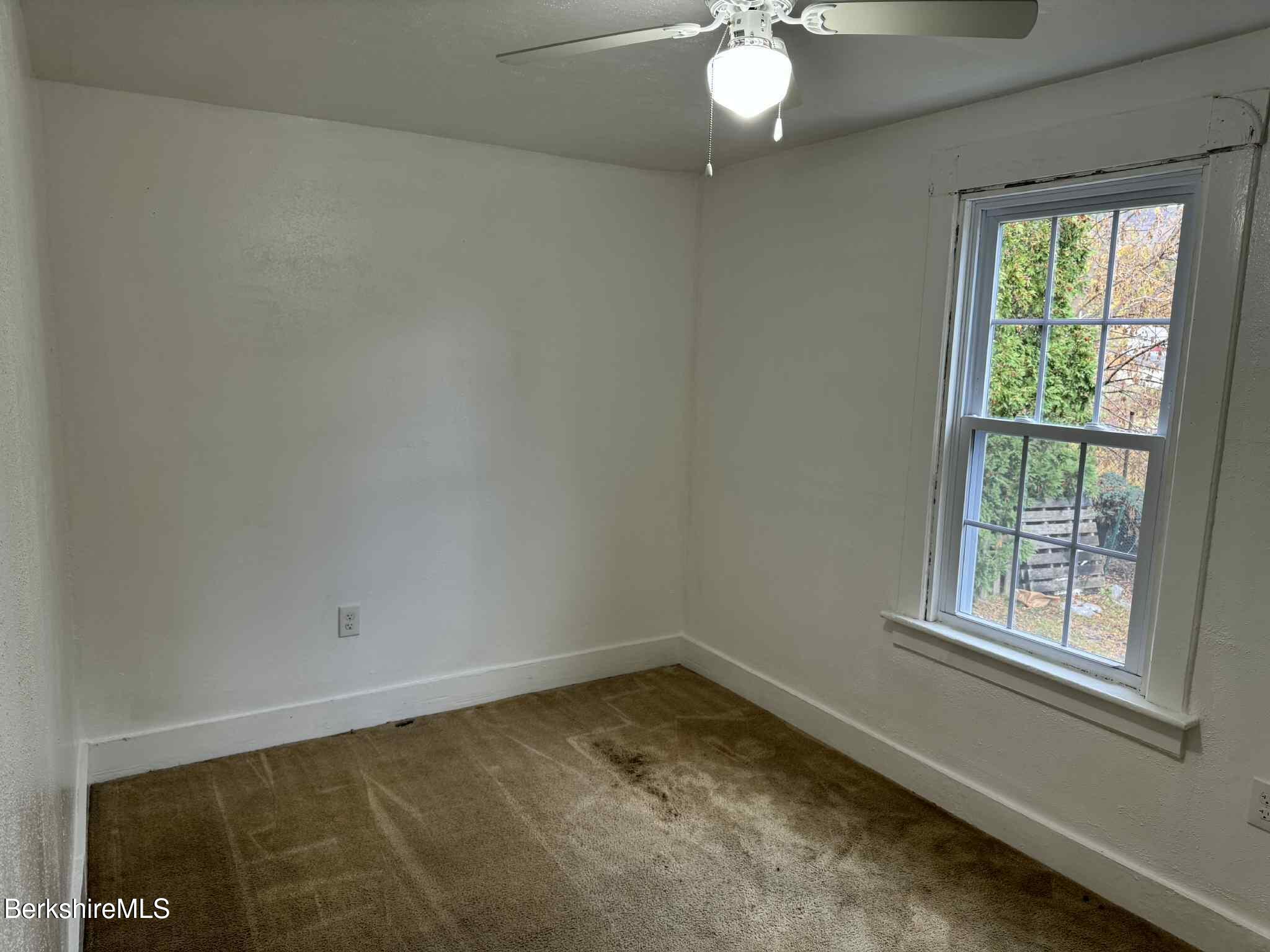 7 Albert Street, Unit 1 Adams, MA 01220 - Photo 3 of 9 an empty room with a window