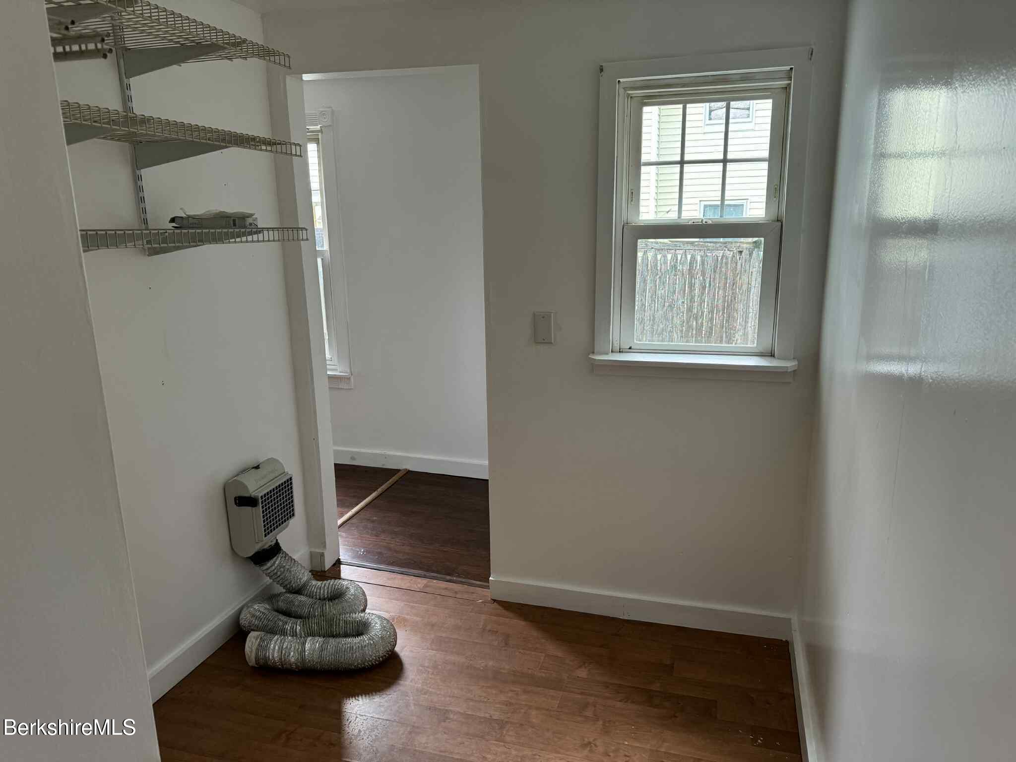 7 Albert Street, Unit 1 Adams, MA 01220 - Photo 4 of 9 a room with furniture and a window