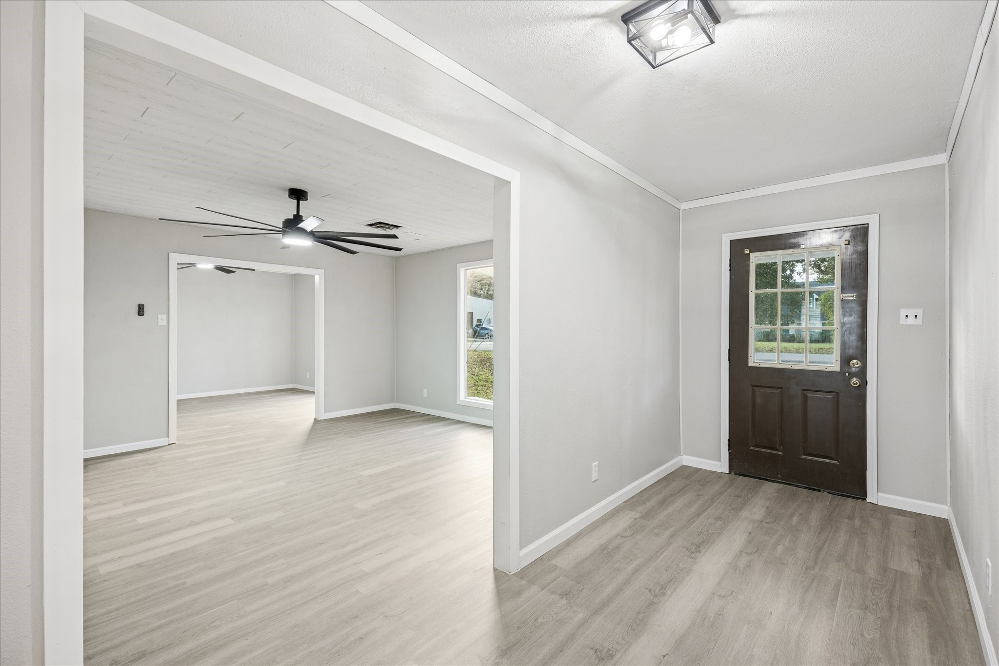 11910 11th Street Santa Fe, TX 77510 - Photo 7 of 30 wooden floor in an empty room with a window