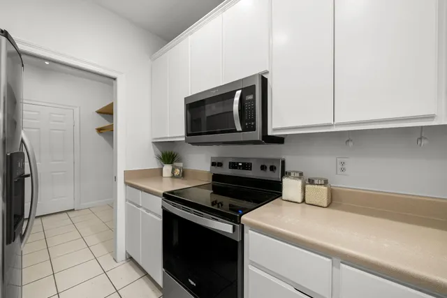 a kitchen with a sink and a stove top oven