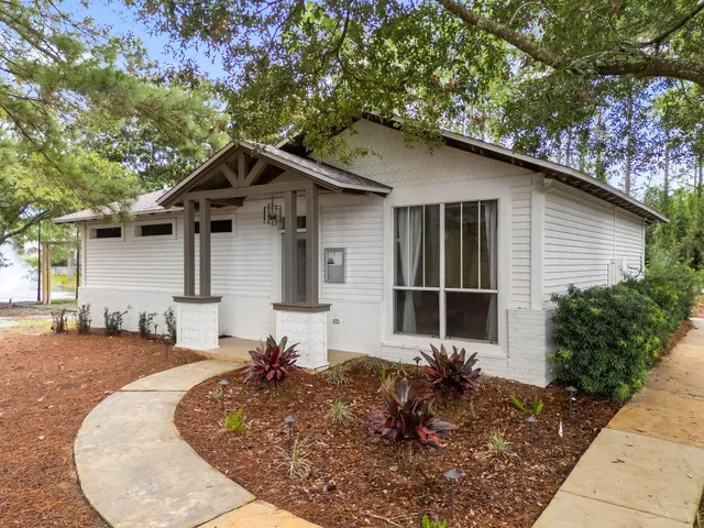 a view of a swimming pool with a yard