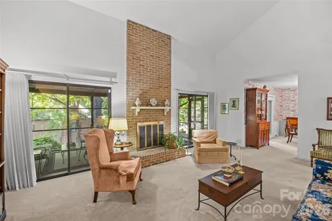 view of living room with furniture and floor to ceiling window