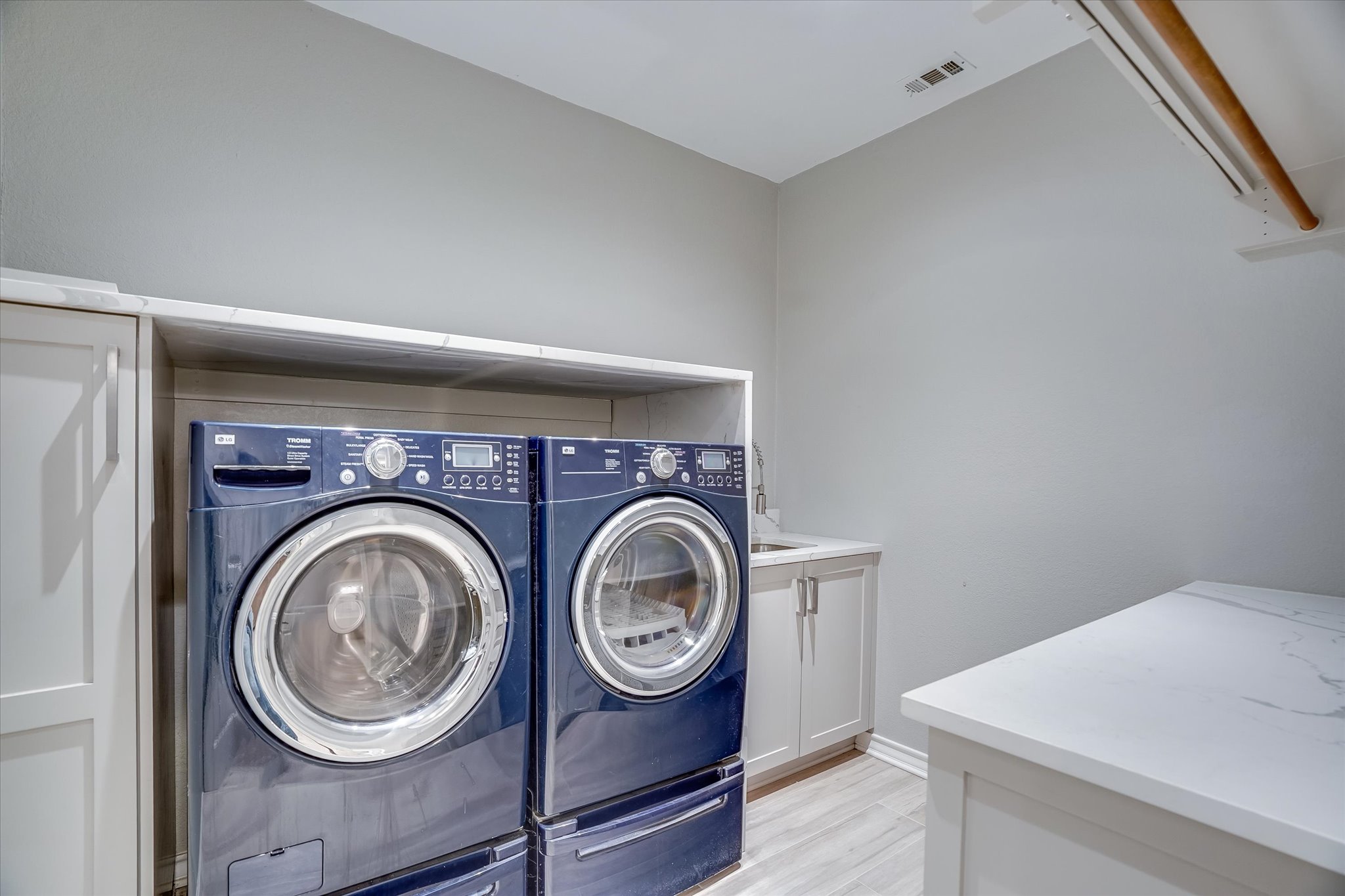 1400 Tom Sawyer Road Austin, TX 78737 - Photo 26 of 40 Updated laundry room (2020) with cabinetry, counters, and functional layout. (Washer Dryer may be negotiated to convey. )
