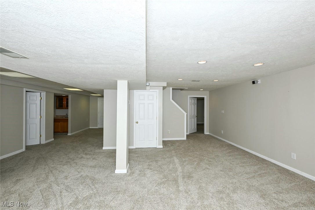 452 Herbert Road Akron, OH 44312 - Photo 33 of 48 *FINISHED BASEMENT HAS 2 ENTRYS, ONE FROM HOME AND OTHER FROM GARAGE. RECREATION ROOM W/MULTIPLE WIDE CLOSETS FOR TONS OF STORAGE! ~