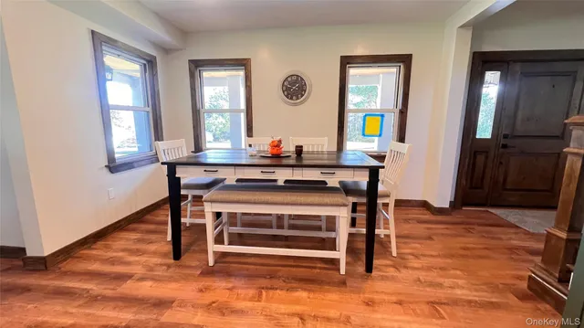 a bedroom with a bed and a wooden floor