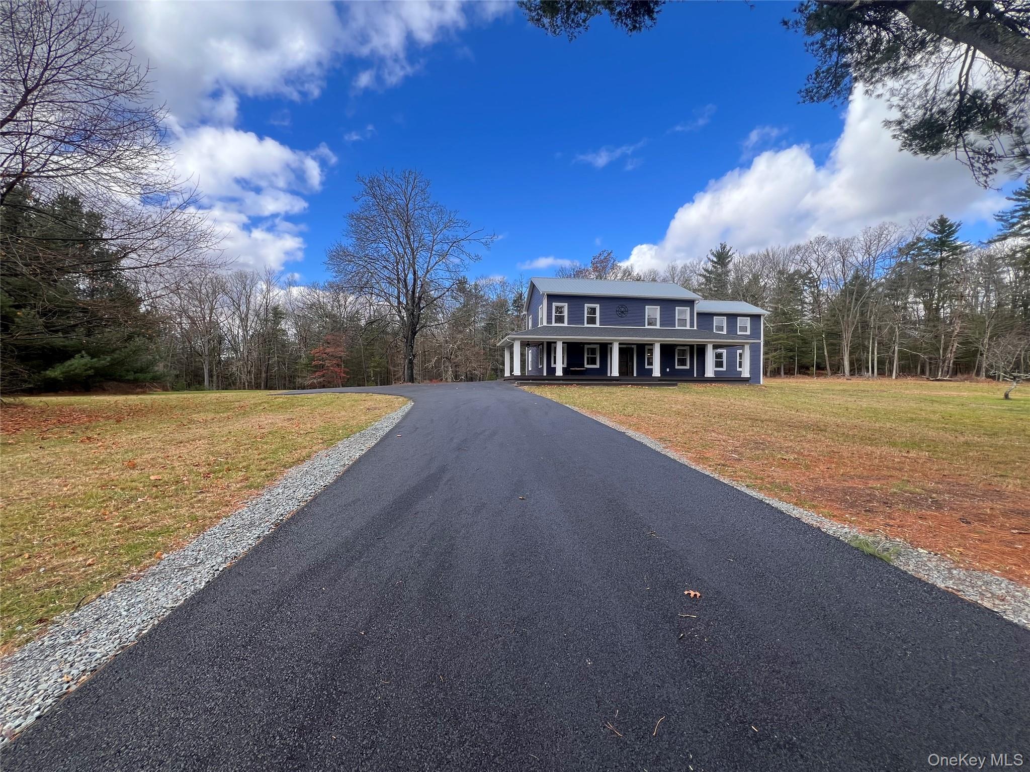79 Dexheimer Road Narrowsburg, NY 12764 - Photo 2 of 29 View of asphalt driveway featuring a forest view