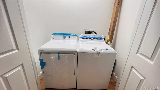 a white toilet sitting next to a small sink